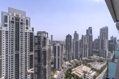 an aerial view of a city with tall buildings at Stylish 2Bedroom w infinity pool on the 64th floor in Dubai
