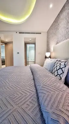 a bedroom with a large bed in a room at Luxury Paramount Hotel Apt B666 in Dubai