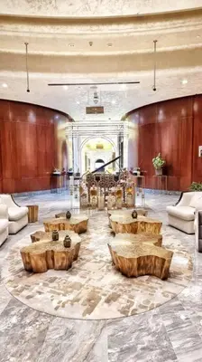 a lobby with tables and chairs in a building at Luxury Paramount Hotel Apt B666 in Dubai