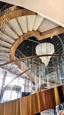 a spiral staircase in a building with a ceiling at Luxury Paramount Hotel Apt B666 in Dubai