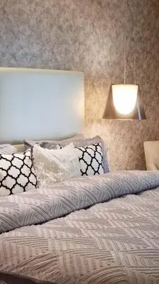 a bedroom with a bed with a light on it at Luxury Paramount Hotel Apt D576 in Dubai