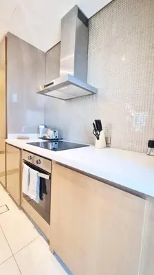 a kitchen with a sink and a counter top at Luxury Paramount Hotel Apt B327 in Dubai