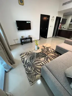 a living room with a couch and a zebra rug at Holiday Rental in Dubai
