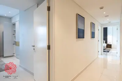 a hallway of a house with white walls at Alashrafia Saray- Waterfront 3 BDR apartment Business Bay in Dubai