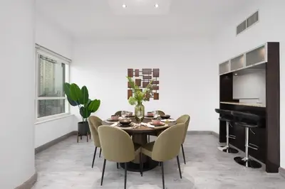 a dining room with a table and chairs and a piano at Maison Privee - Dreamy Apt with Jaw-Dropping Marina Views in Dubai