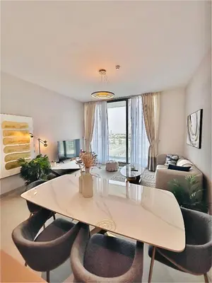 a living room with a large white table and chairs at Modern 1 BR Apartment at JVC Dubai Prime Location! in Dubai