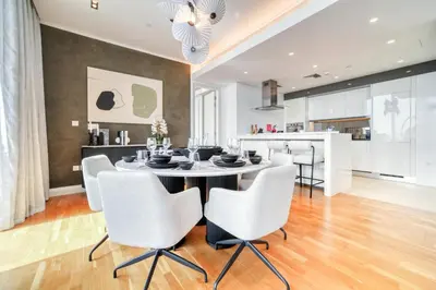 a kitchen and dining room with a table and chairs at Bluewaters Residences - Sea View, Bluewaters Island - Mint Stay in Dubai