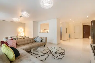a living room with a couch and a table at Chic 2BR Duplex, Huge Balcony High-End Furniture - Allsopp&Allsopp in Dubai