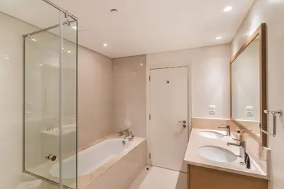 a bathroom with a tub and a sink and a shower at Chic 2BR Duplex, Huge Balcony High-End Furniture - Allsopp&Allsopp in Dubai