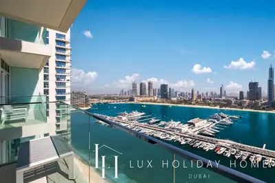 a view of a marina from the balcony of a building at LUX The Luxury Sunrise Beachfront Suite 2 in Dubai