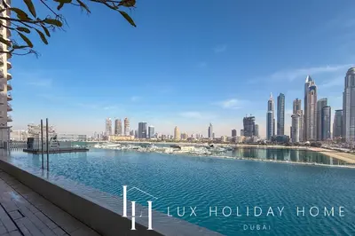 a view of a city skyline with a body of water at LUX The Luxury Sunrise Beachfront Suite 2 in Dubai