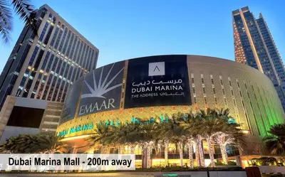 a large building in a city with tall buildings at Luxury Escapes - Modern Studio Apt - Steps to Metro, Marina Mall and JBR Beach - Marina Pearl in Dubai