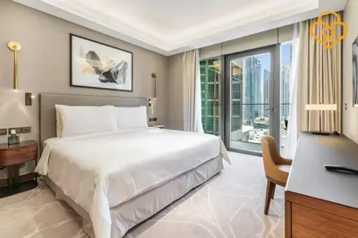 a bedroom with a large bed and a large window at Keysplease 2BR Apt Address Opera Minutes to Dubai Mall, Downtown 29 in Dubai