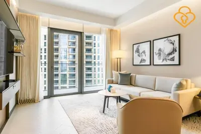 a living room with a couch and a tv at Keysplease 2BR Apt Address Opera Minutes to Dubai Mall, Downtown 29 in Dubai
