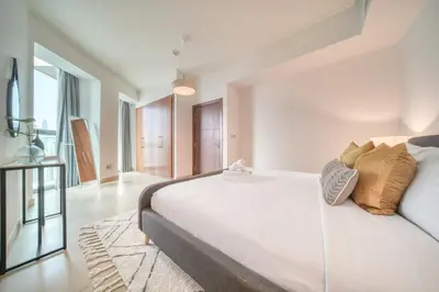 a bedroom with a white bed with pillows on it at Burj Vista Tower 1 - City View, Downtown Dubai - Mint Stay in Dubai