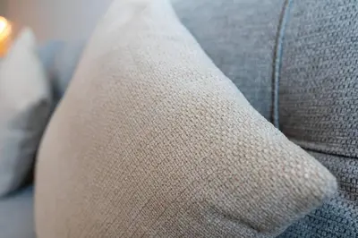 a close up of the arm of a couch at 1bdr in Belgravia Heights - JVC - Dubai in Dubai
