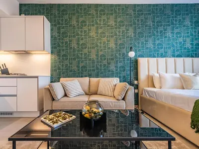 a living room with a couch and a table at Superb Studio in Luma 21-JVC in Dubai