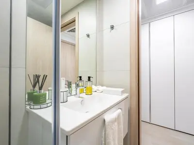 a bathroom with a white sink and a mirror at Superb Studio in Luma 21-JVC in Dubai