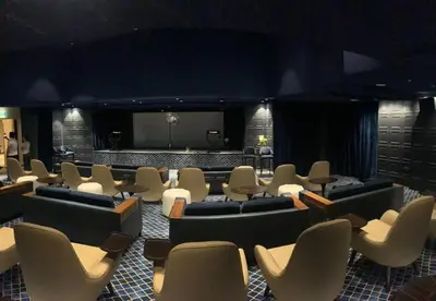a room with couches and chairs and a stage at Keysplease Luxury 1 B/R Apt in Paramount Towers by Damac in Dubai