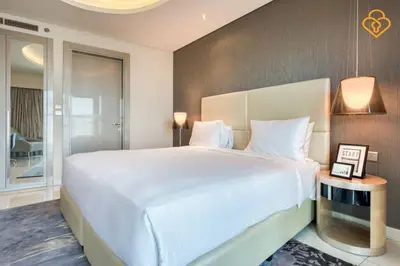 a bedroom with a large white bed in a room at Keysplease Luxury 1 B/R Apt in Paramount Towers by Damac in Dubai