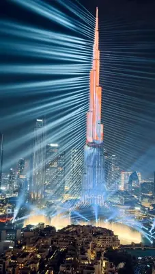 a rendering of a tall building in a city at night at Burj Royale Residences Downtown Dubai - Burj Khalifa District in Dubai