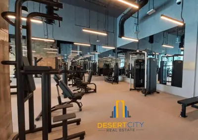 a gym with several treadmills and machines at Fully Furnished 1 Bed in Downtown Dubai, Hosted by Desert City Stays in Dubai