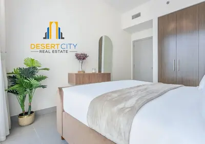 a bedroom with a white bed and a mirror at Fully Furnished 1 Bed in Downtown Dubai, Hosted by Desert City Stays in Dubai