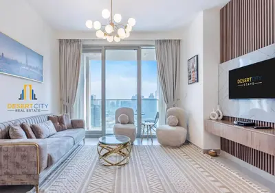 a living room with a couch and a tv at Fully Furnished 1 Bed in Downtown Dubai, Hosted by Desert City Stays in Dubai