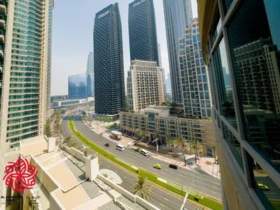 a view of a city with tall buildings and a highway at Alashrafia Saray- Central 2BR apartment in Downtown in Dubai