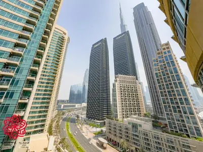 a group of tall buildings in a city at Alashrafia Saray- Central 2BR apartment in Downtown in Dubai