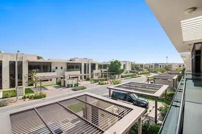 a balcony with a view of a parking lot at StoneTree - Pelham Villa 3 BR - Damac Hills in Dubai