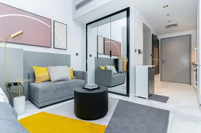 a living room with a couch and a table at MAG 318 Studio Walk to Dubai Mall in Dubai