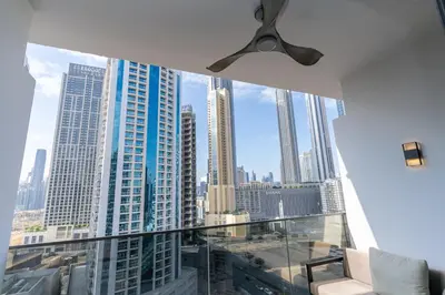 a room with a view of a city skyline at MAG 318 Studio Walk to Dubai Mall in Dubai