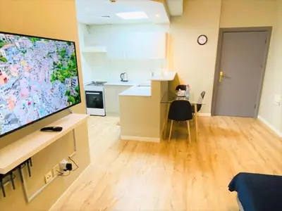a living room with a large flat screen tv at Royal Manor- Marina Diamond 2 in Dubai
