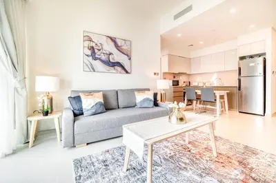 a living room with a couch and a table at Burj Royale, Downtown Dubai - Mint Stay in Dubai
