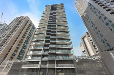 a tall building in the middle of two tall buildings at WelHome - Contemporary 1BR in Binghatti Canal & Burj Views in Dubai