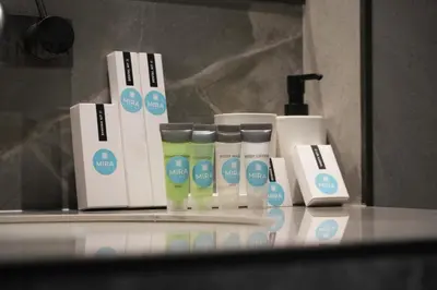 a group of products sitting on a counter in a bathroom at Mira Holiday Homes - Newly 1 bedroom with pool access in Dubai