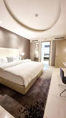 a bedroom with a large bed with a round ceiling at Luxury Paramount Hotel Apt A662 in Dubai