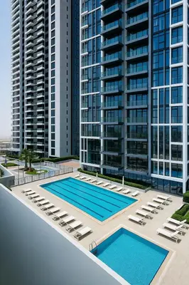 an image of an apartment complex with two pools at Luxurious & Modern Studio in JVC in Dubai