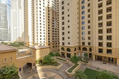 an aerial view of a building with tall buildings at StoneTree - Spacious 2 BR near JBR beach in Dubai
