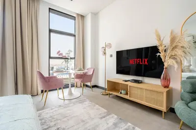 a living room with a tv and a table at GuestReady - Lux comfort in Business Bay in Dubai
