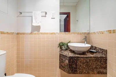 a bathroom with a sink and a toilet at GuestReady - Luxurious Marina view residence in Dubai