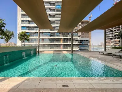 a swimming pool on the roof of a building at Sea view 2-Bedroom - Beach Isle in Dubai