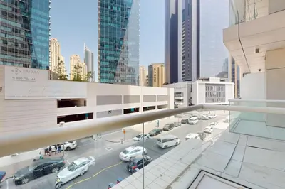 a view of a parking lot with cars in a city at West Avenue - Chic One Bedroom in Dubai