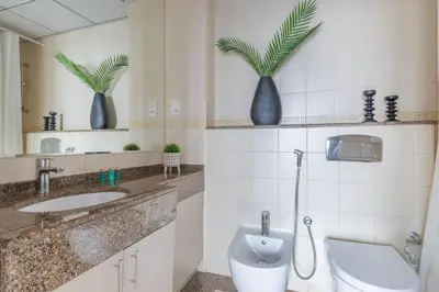 a bathroom with a toilet and a sink at Frank Porter - Bay Central 1 in Dubai