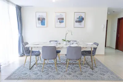 a dining room with a table and chairs at BAHAR apartments on JBR by HAPPY SEASON in Dubai