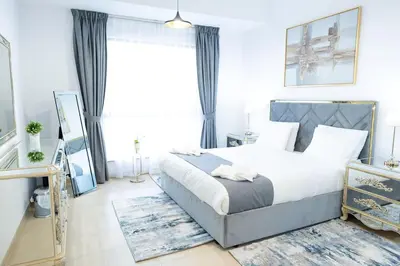 a bedroom with a bed and a large window at SHAMS 2 bedrooms apartment on JBR by HAPPY SEASON in Dubai
