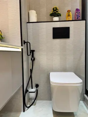 a bathroom with a white toilet in a room at Warm and Elegant Studio in Dubai in Dubai