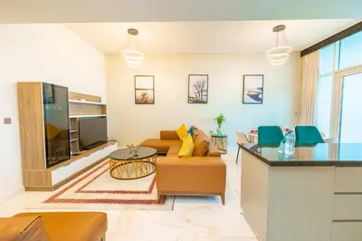 a living room with a couch and a table at FAM Living - Bayz Tower by Danube - Business Bay in Dubai