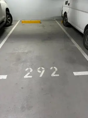 a parking lot with two cars parked in it at Amazing views Dubai eye & Palm in Dubai